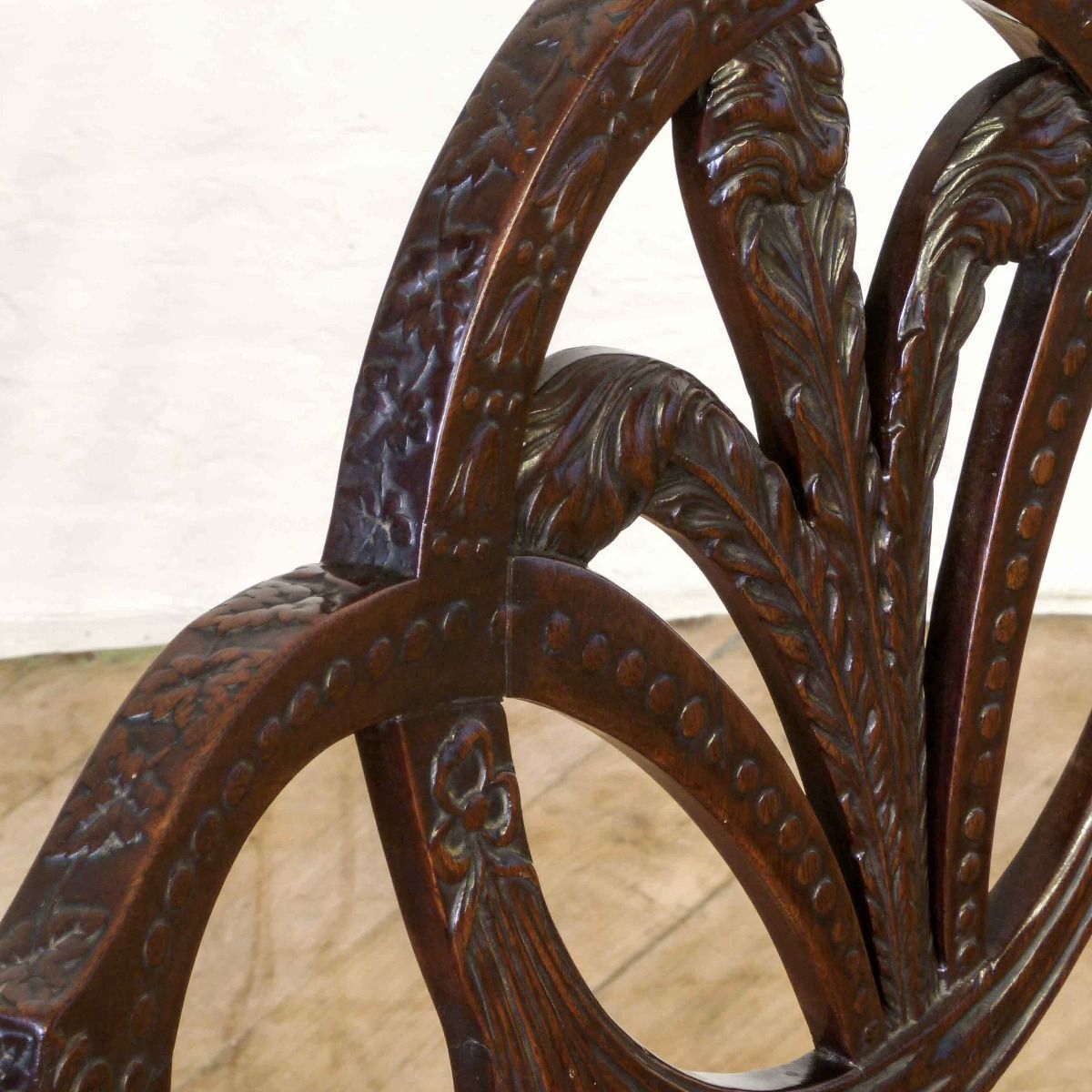 A Pair Of Edwardian Mahogany Armchairs In The Manner Of Hepplewhite. Profusely Carved With Foliage, Flowers, Ribbons And Swags. The Central Shield Bac photo Furniture