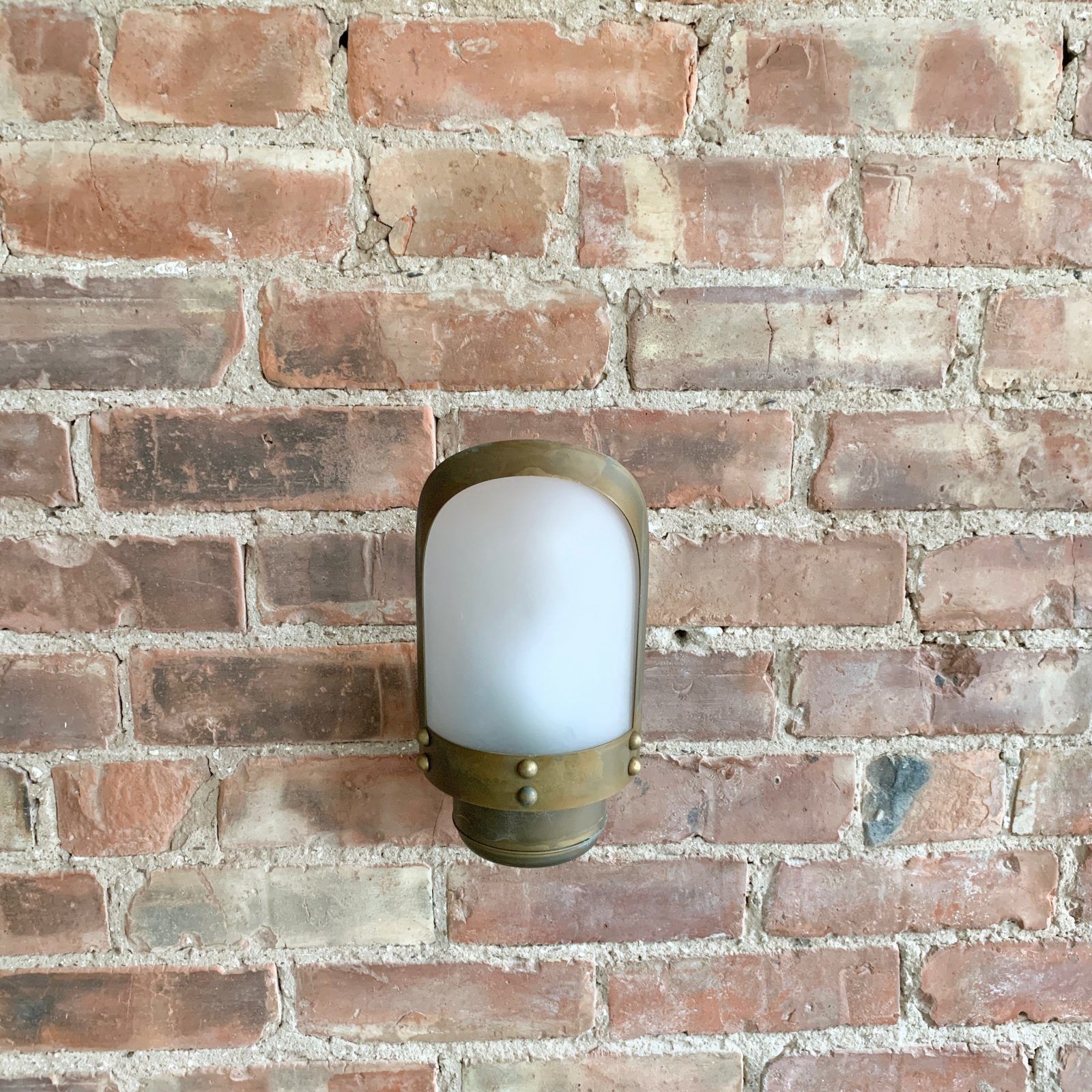 Contemporary Aged Brass Wall Light With Frosted Shade photo for sale