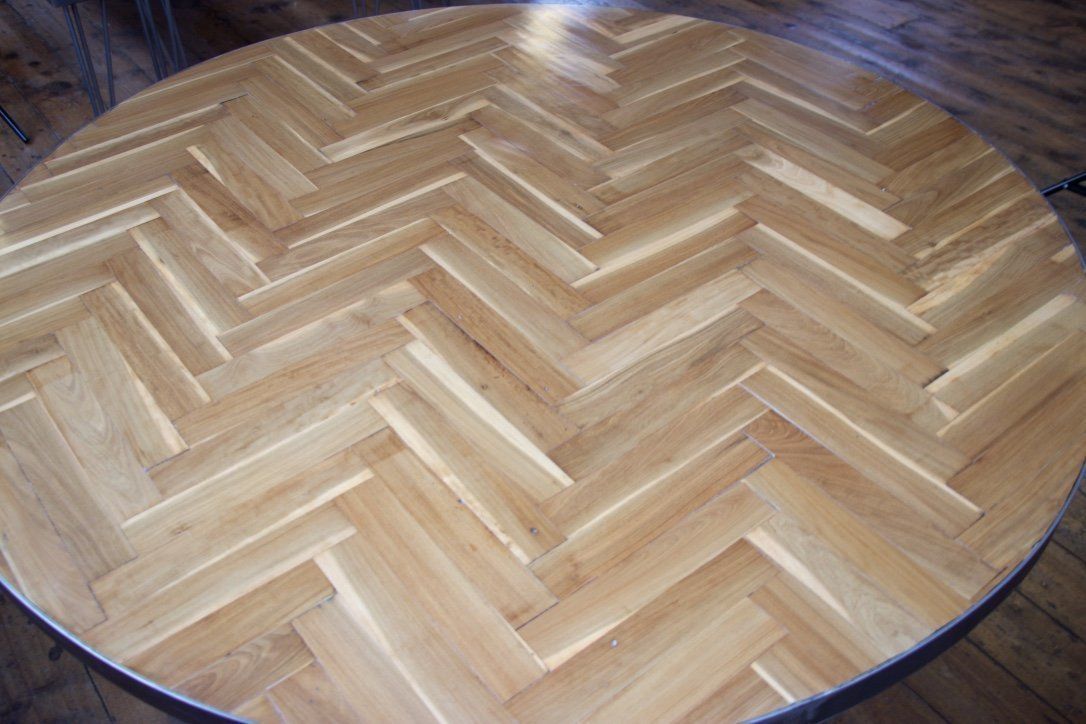 Industrial Round 4ft Table Made From Reclaimed Parquet Floor On A Steel Cross Base photo vinterior