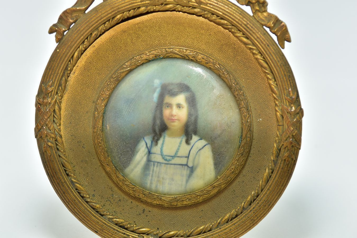 Miniature Portrait In Medallion Young Girl With Brown Curls Gilt Bronze Frame With Ribbons photo for sale