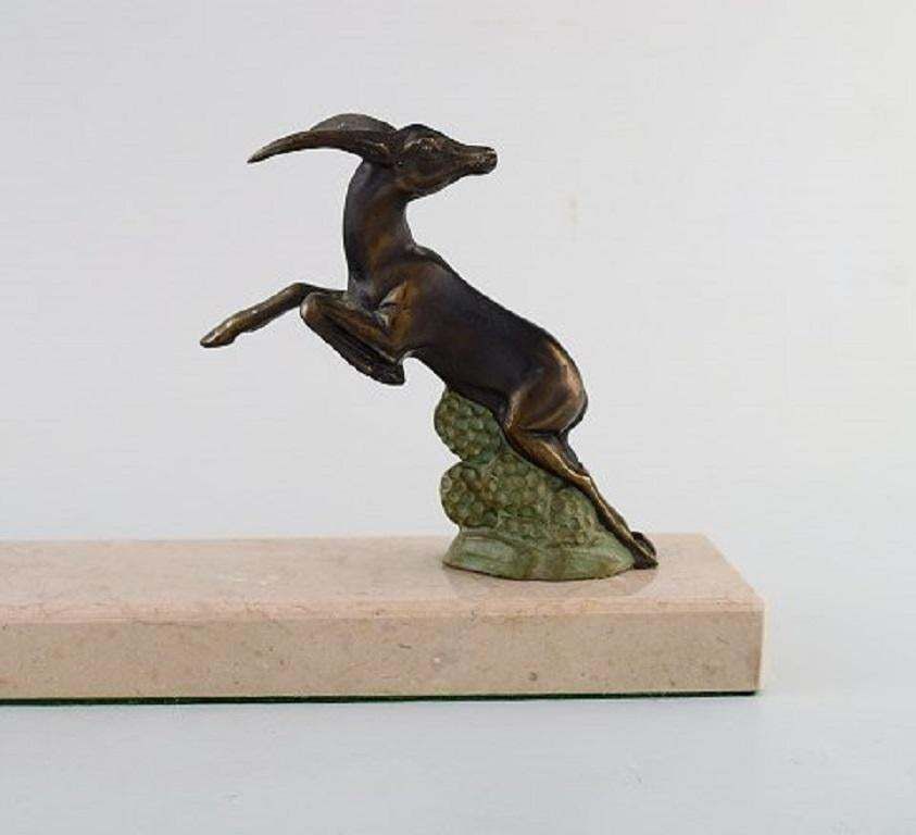 Art Deco Sculpture Of Jumping Bucks In Patinated Metal On Marble Base, 1930s photo furniture