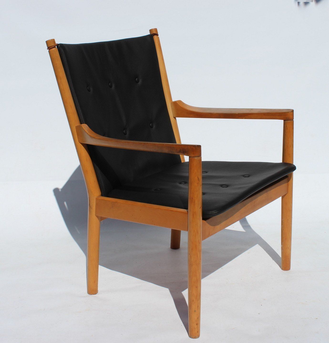 Armchair   Model 1788, With Beech Backrest And Cushions In Black Leather By Hans J. Wegner    Fritz Hansen, 1978. photo furniture