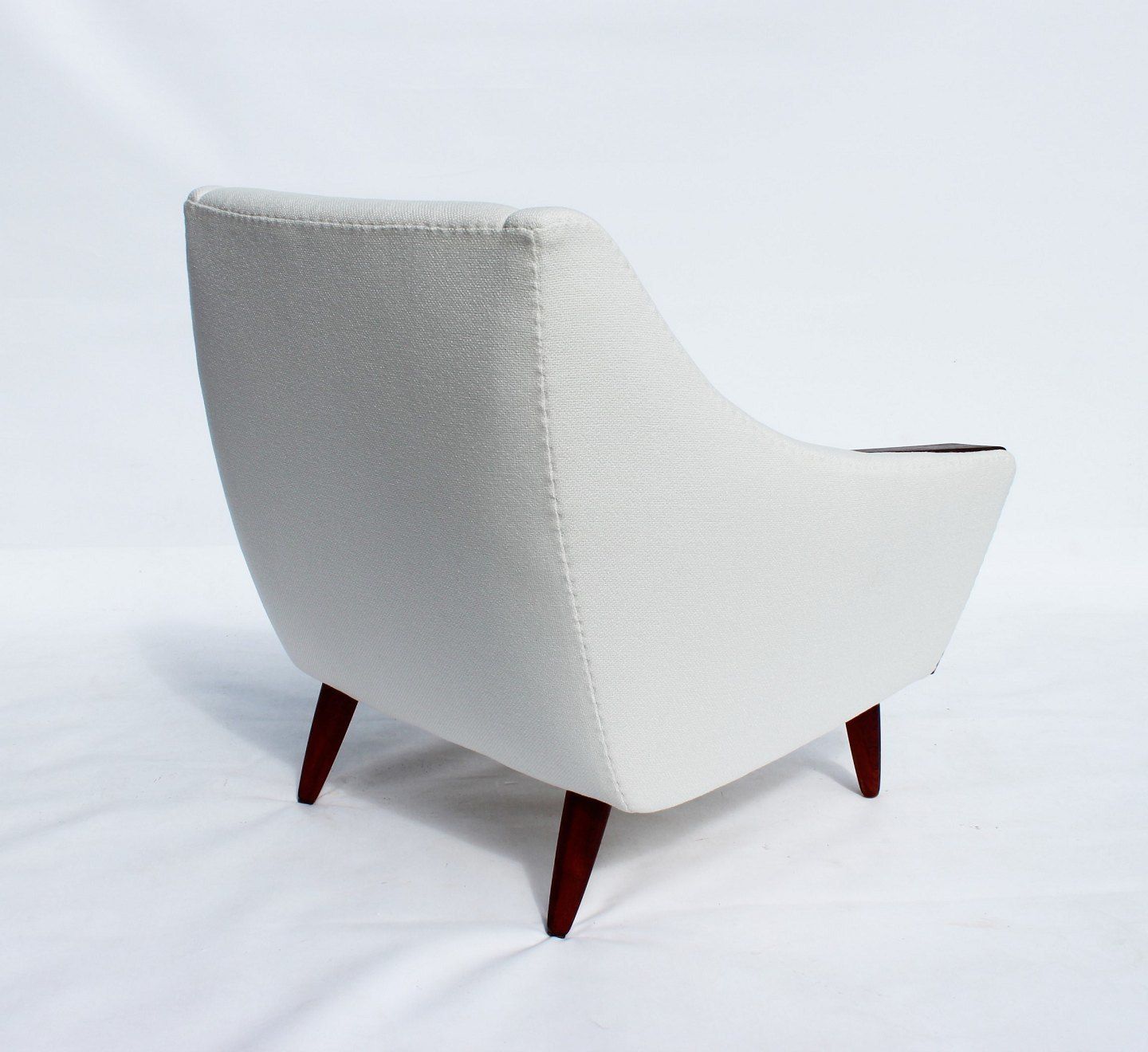 Armchair With Low Back Upholstered In White Fabric With Rosewood Of Danish Design From The 1960s photo for sale