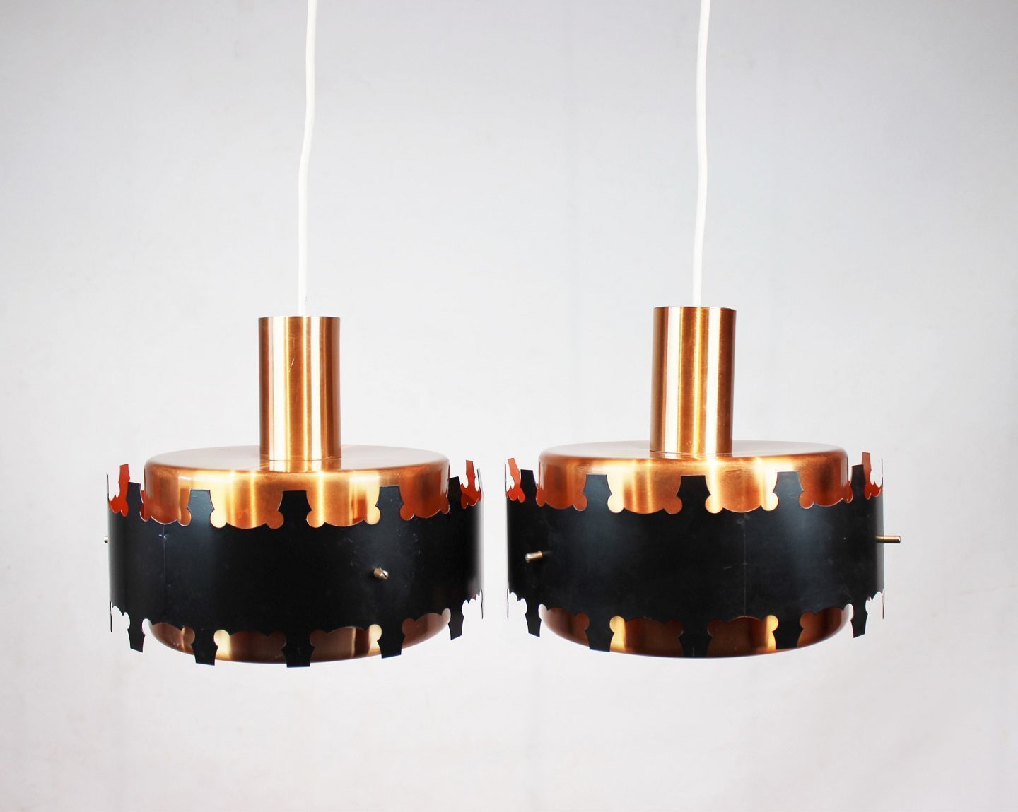 A Pair Of Pendants Of Copper And Black Metal, Of Danish Design From The 1970s.