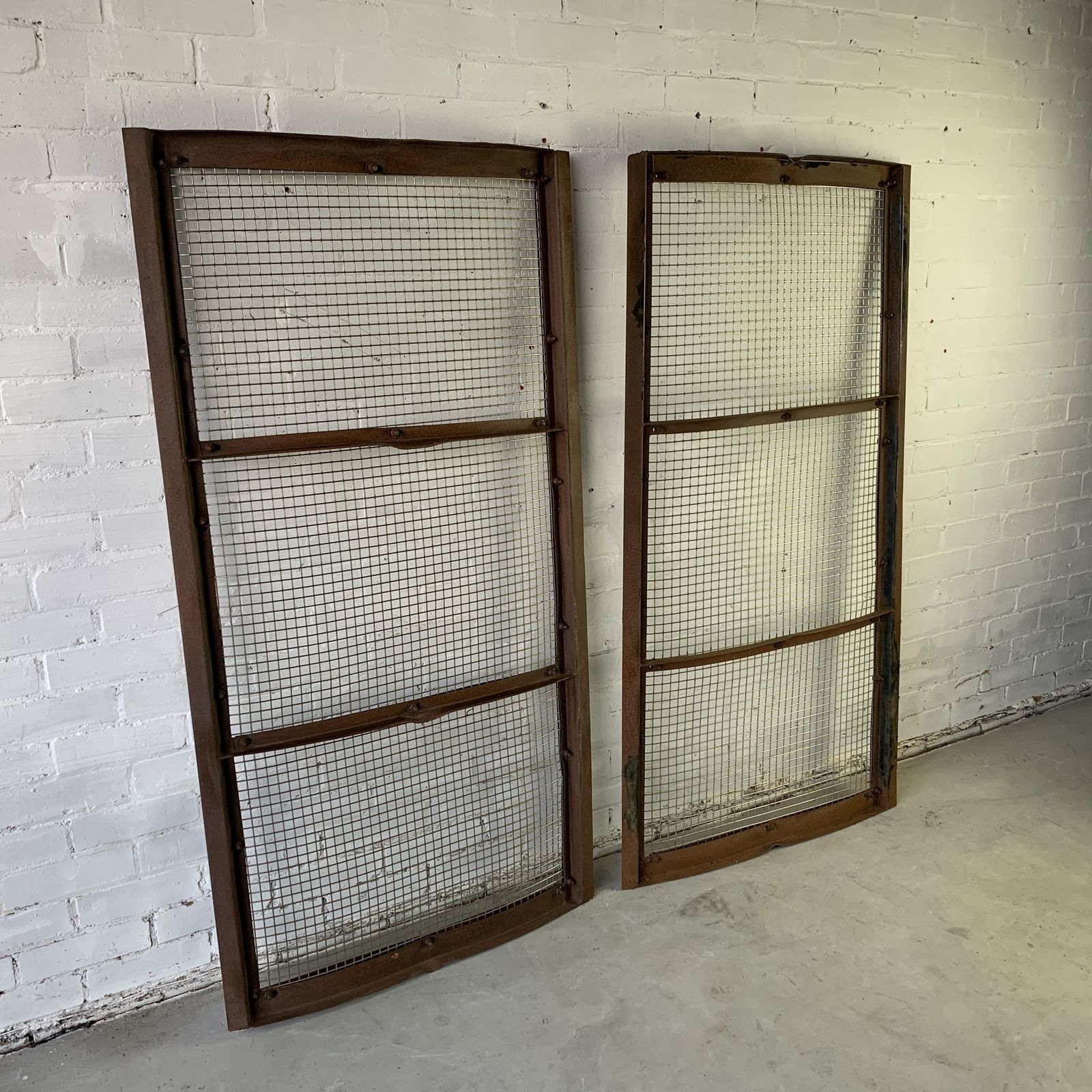 Pair Of Vintage Curved Steel Screens With Stainless Steel Grilles photo for sale