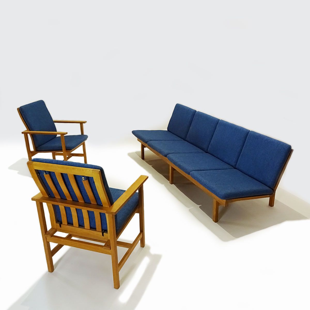photo furniture Danish Mid Century Børge Mogensen 4 Seater Oak Bench Sofa And Two Armchairs.
