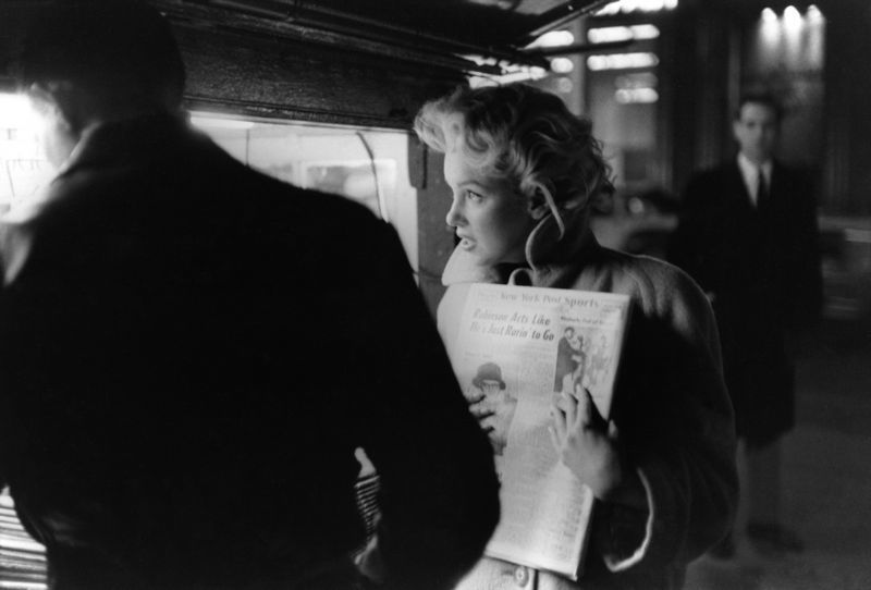 'Marilyn Gets The Paper' Marilyn Monroe 1955 Silver Gelatin Print Framed In White photo furniture