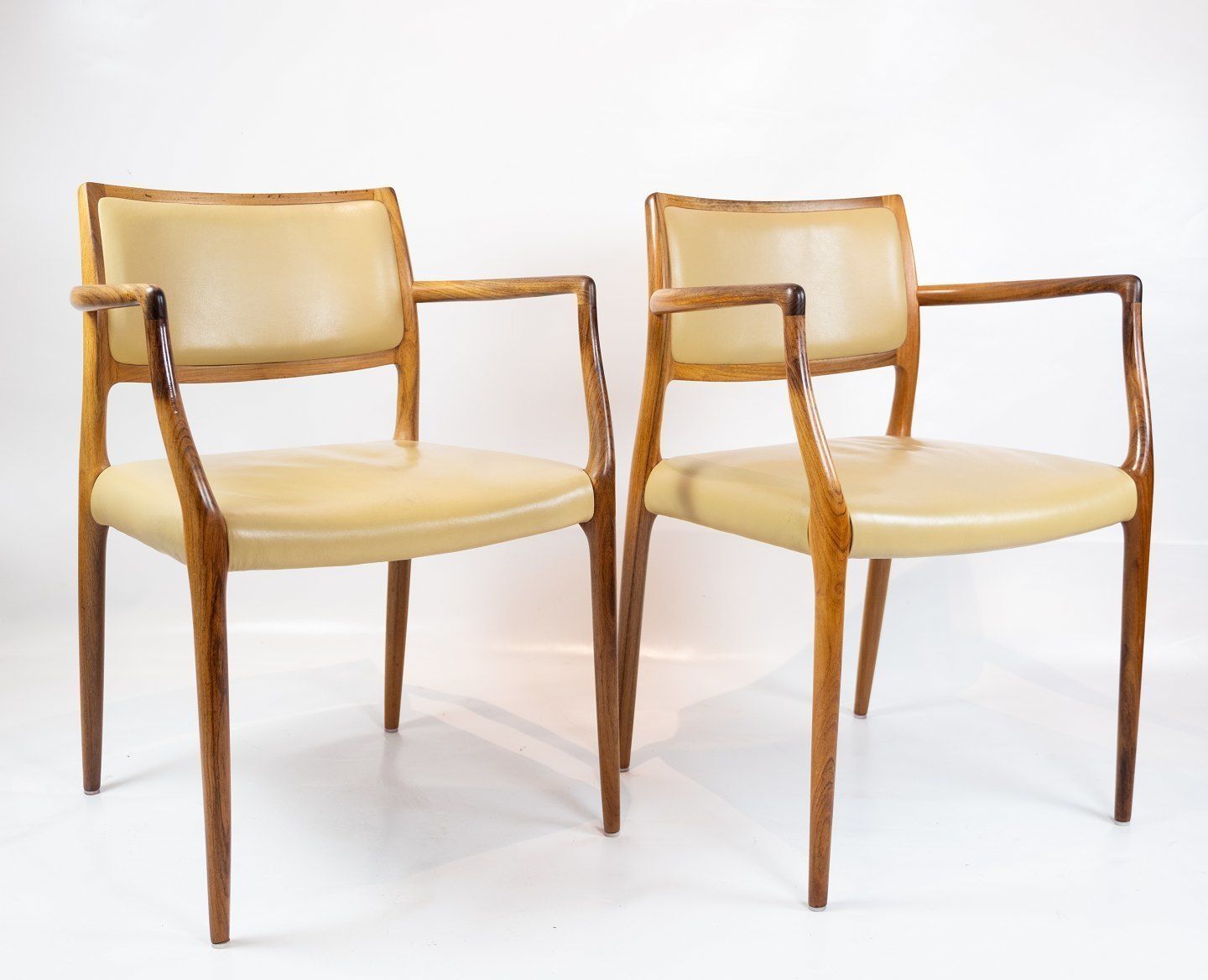 A Pair Of Armchairs, Model 65 Made In Rosewood  And Bright Leather By Niels O. Møller And J.L. Moller   1968 photo furniture