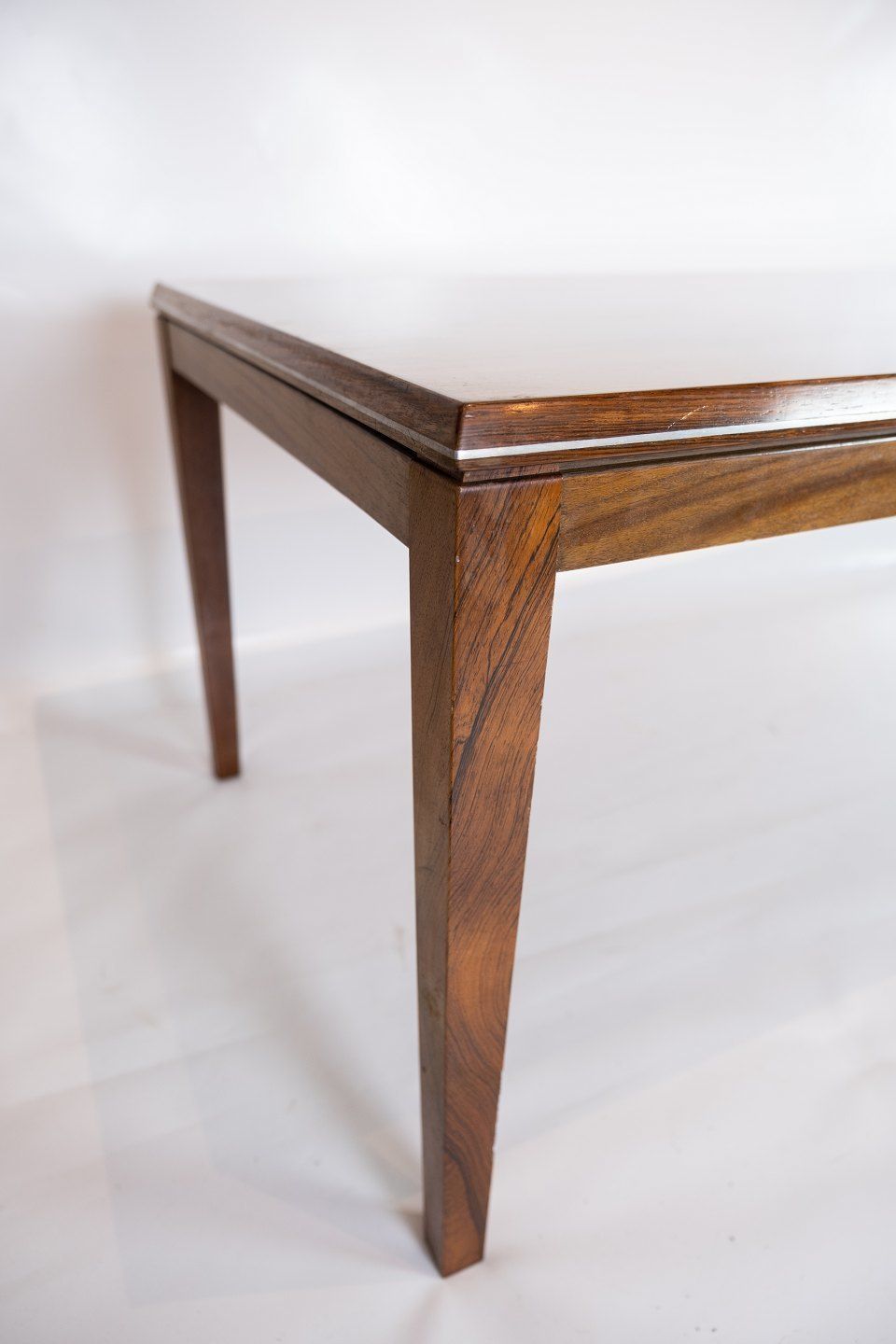 Coffee Table Made In Rosewood Decorated With Metal Edge Of Danish Design From The 1960s. photo 790.0
