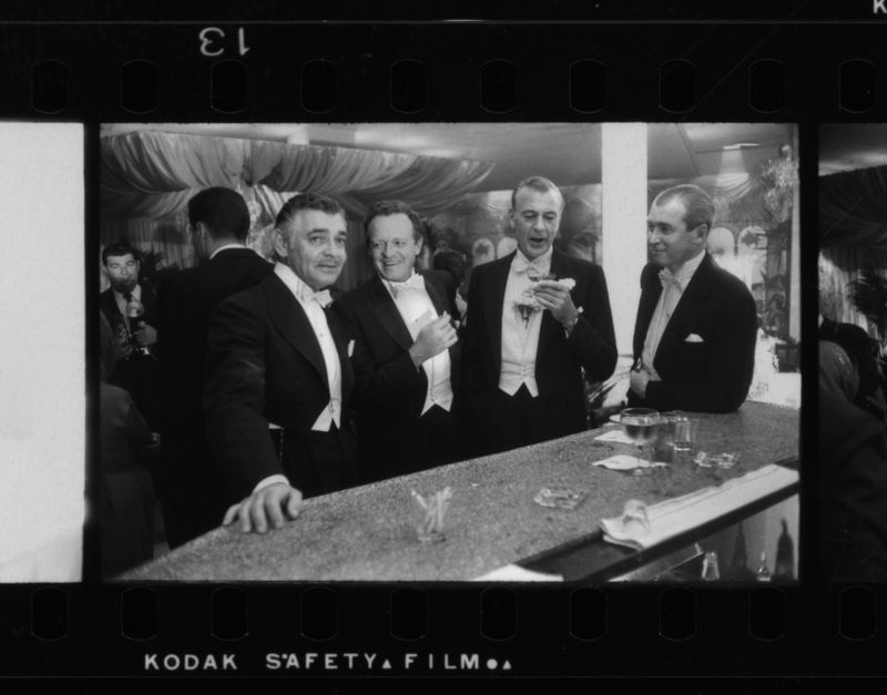 Slim Aarons 'New Year At Romanoff’s' 1957 Silver Gelatin Print Framed In Black photo furniture