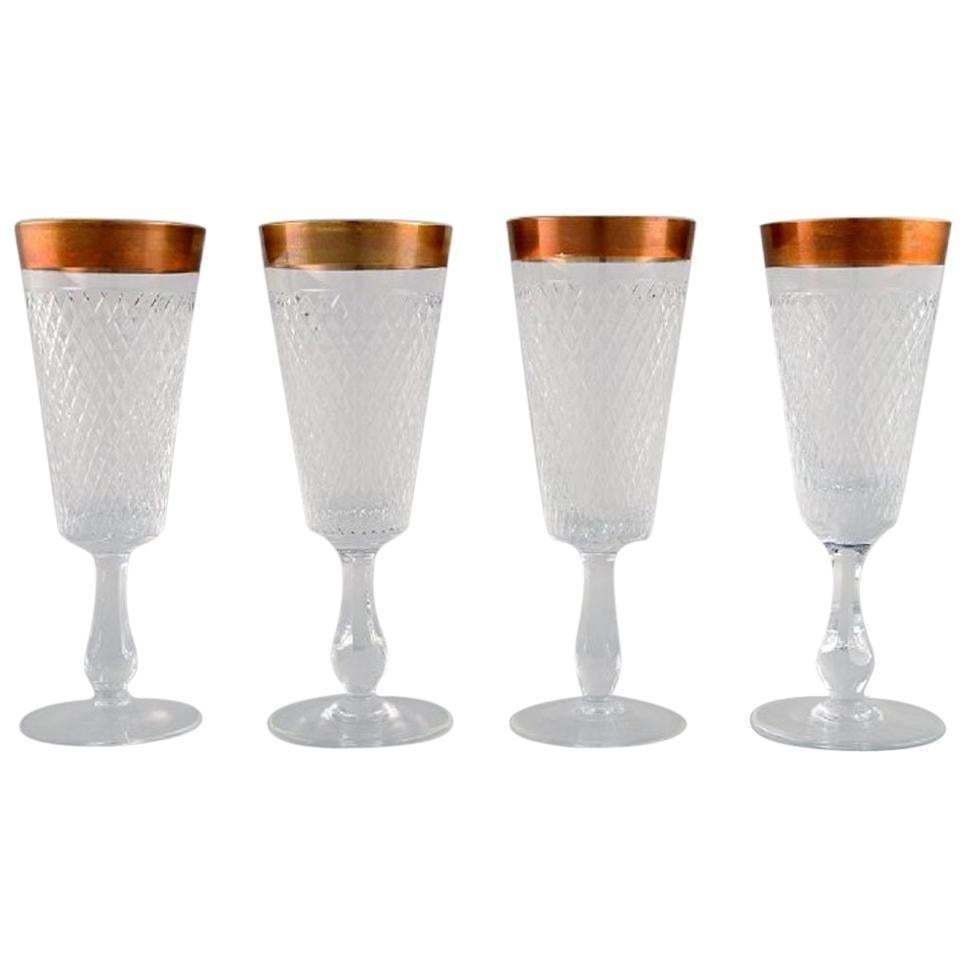 Four Champagne Glasses In Mouth Blown Crystal Glass With Gold Edge, France 1930s
