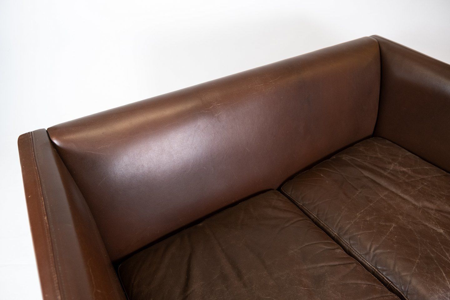 Two Person Sofa Upholstered With Dark Brown Leather Of Danish Design Made By Stouby Møbelfabrik From The 1960s. photo for sale