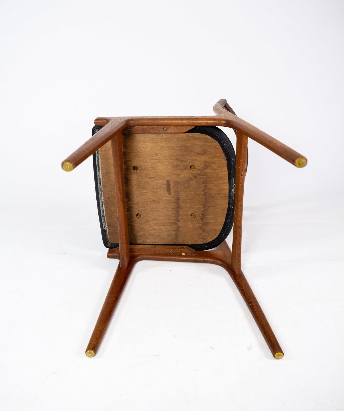 A Set Of Four Dining Chairs In Teak And Upholstered With Black Leather Of Danish Design From The 1960s. photo buy