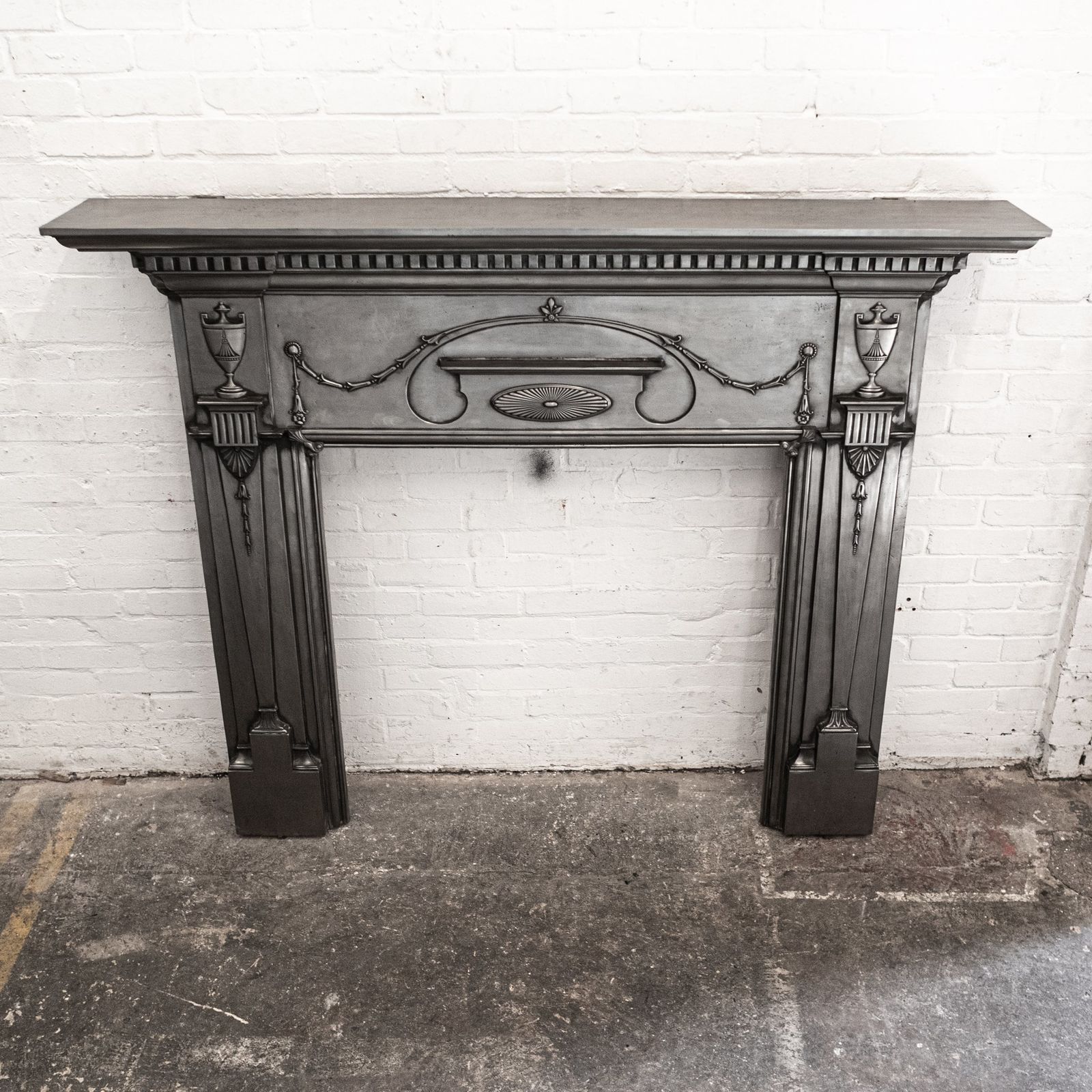 photo buy Antique Polished Cast Iron Fireplace Surround