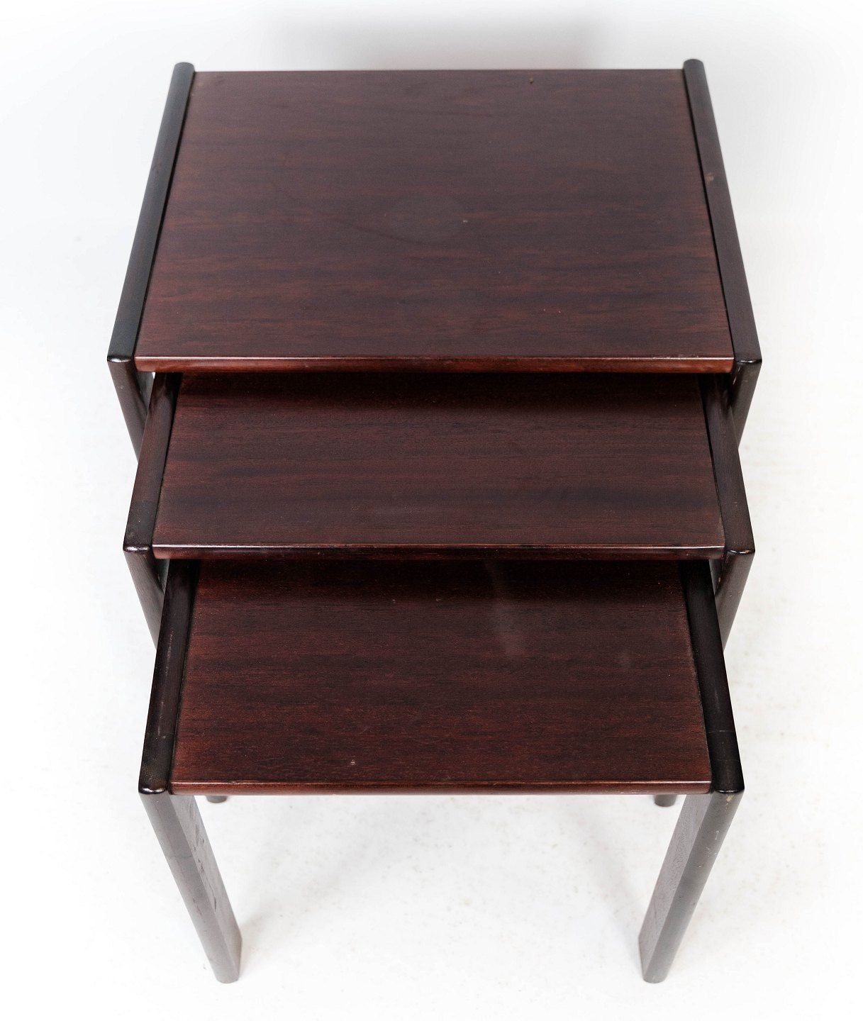 Set Of Insert Tables In Dark Wood Of Danish Design From The 1960s. photo for sale