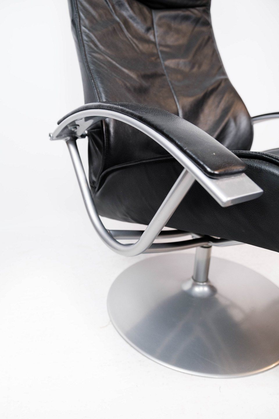 photo furniture Armchair With Stool Upholstered In Black Leather And Metal Frame, By Danish Design From The 1970s.