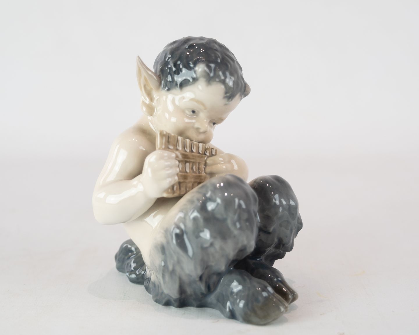 Kgl. Porcelain Pan Figure With Flute, No .: 1736 By Royal Copenhagen.