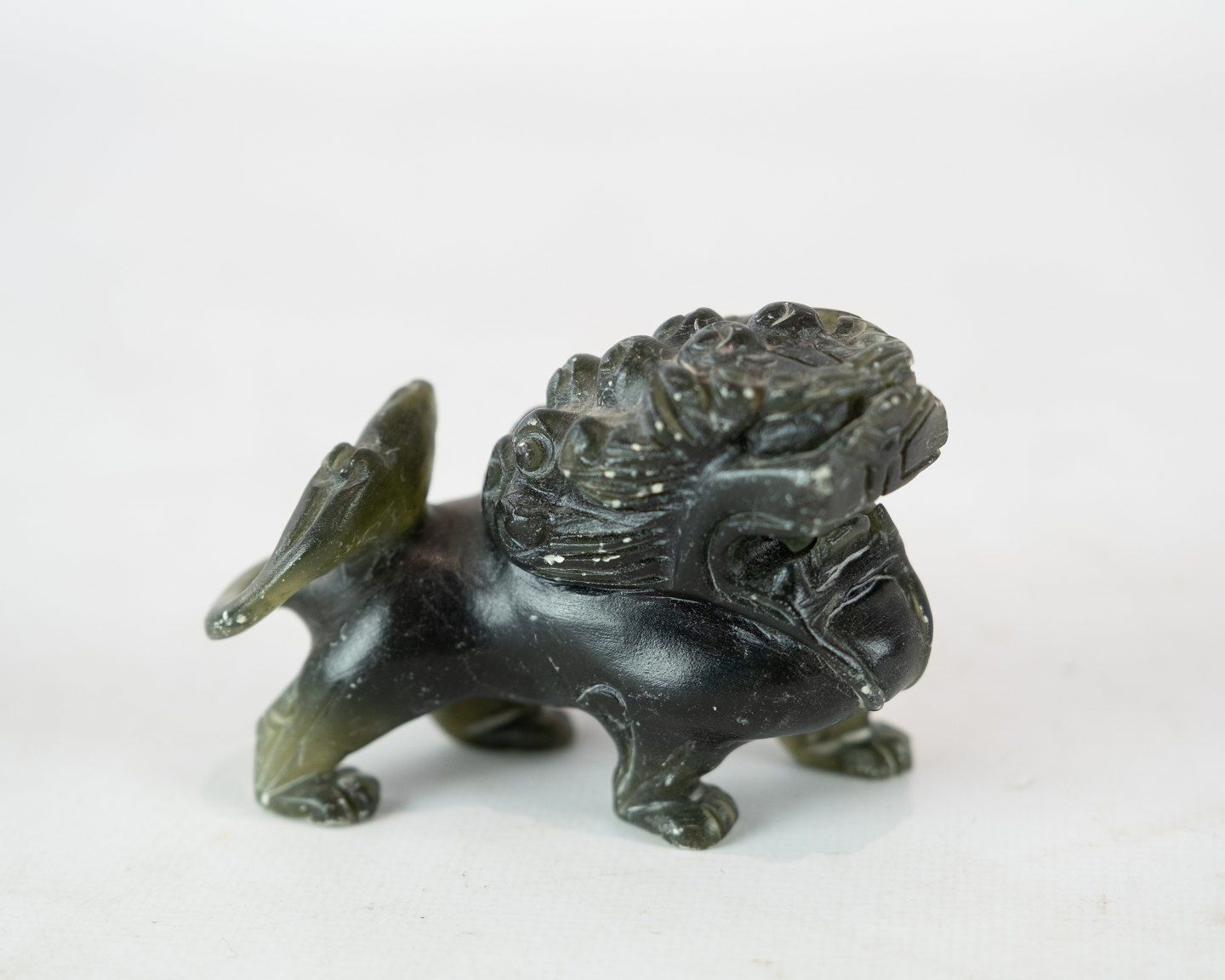 A Pair Of Soapstone Figures In The Shape Of Lions photo for sale