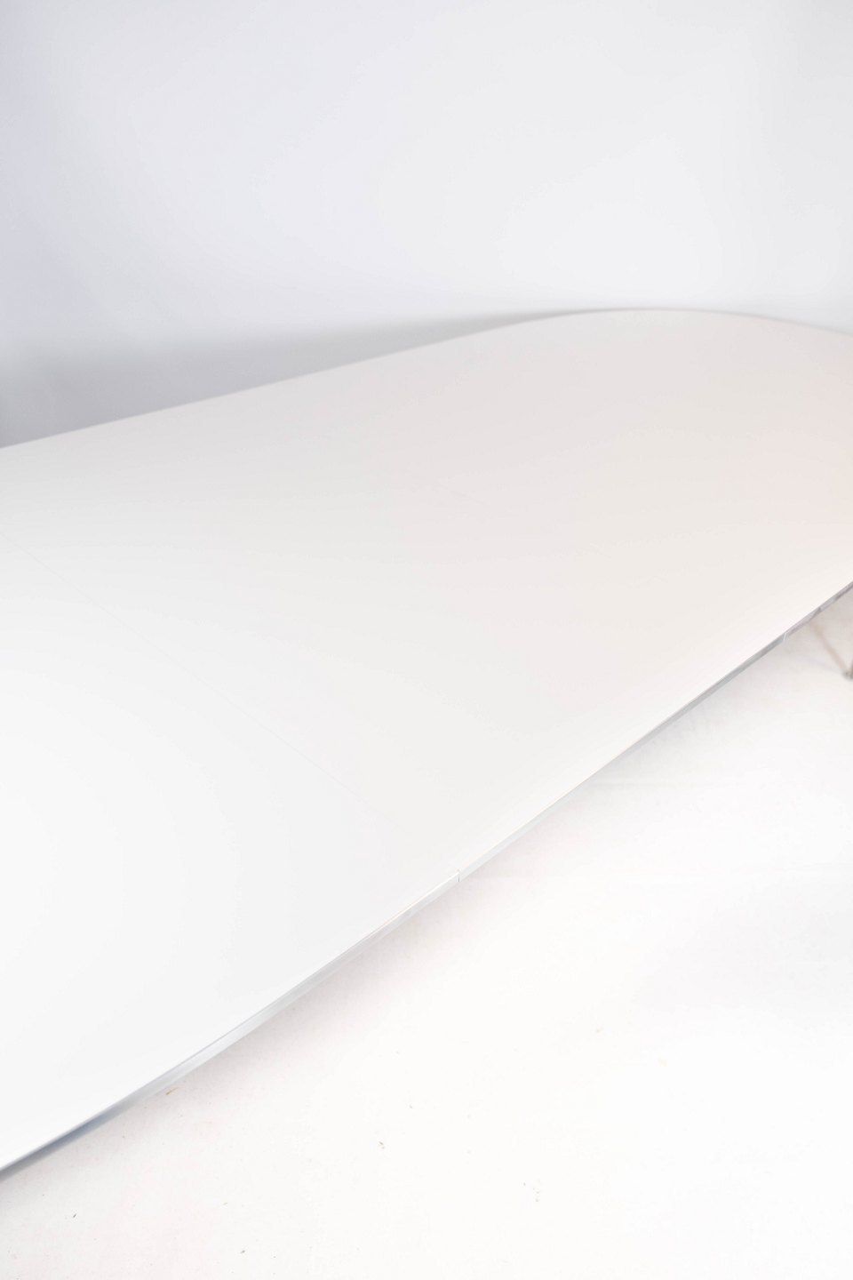 Super Ellipse Dining Table With White Laminate Designed By Piet Hein And Arne Jacobsen, And Manufactured By Fritz Hansen In 1998. photo 3020.0