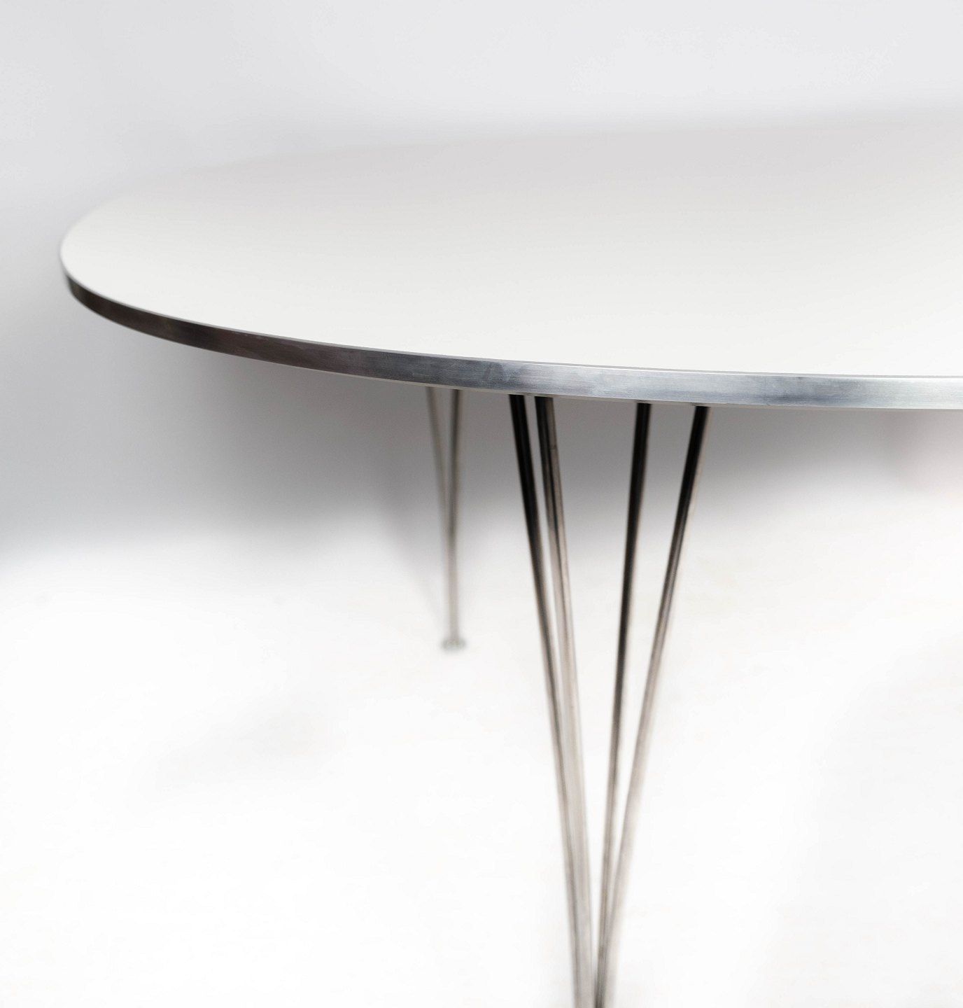 Super Ellipse Dining Table With White Laminate Designed By Piet Hein And Arne Jacobsen, And Manufactured By Fritz Hansen In 1998. photo vinterior