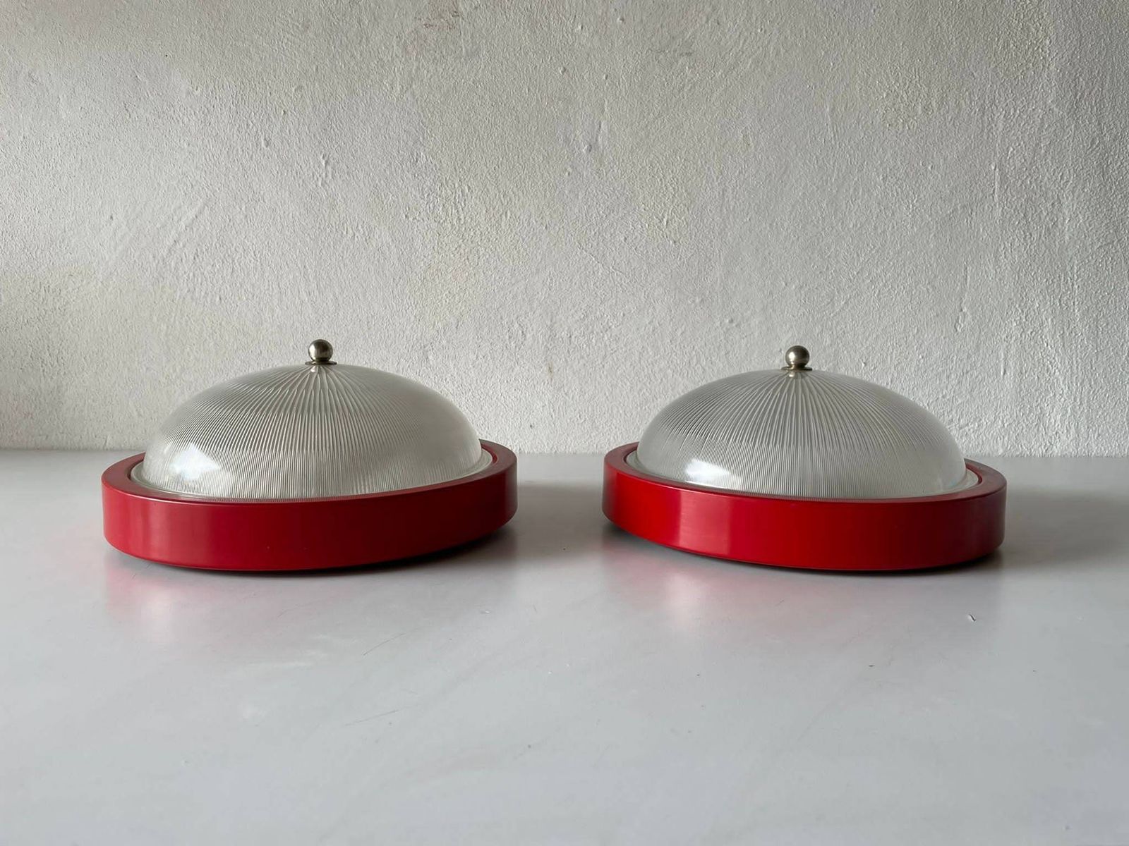 Glass And Red Metal Base Pair Of Sconces Or Ceiling Lamps By Reggiani, 1970s, Italy photo for sale