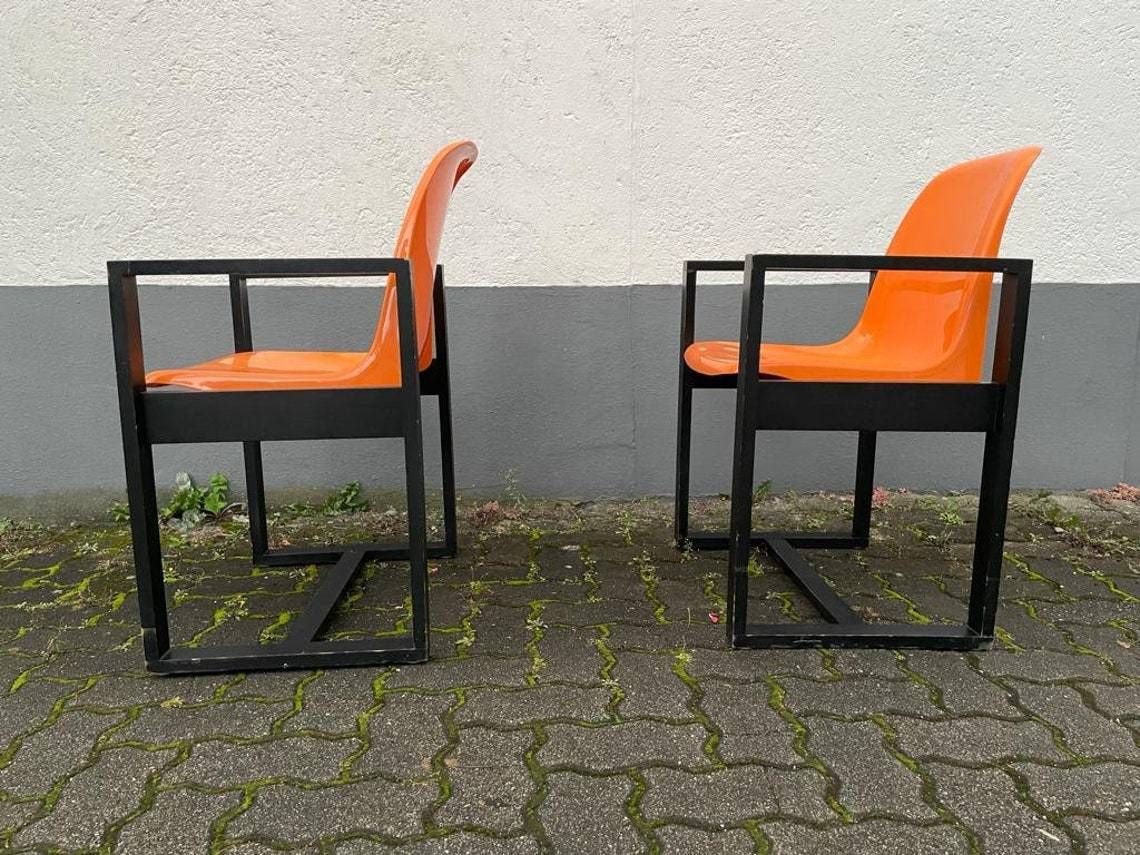 Titlespace Age Orange Plastic Seat And Wood Frame Pair Of Chairs By Möbel Mann 1960s Germany photo 2077.0