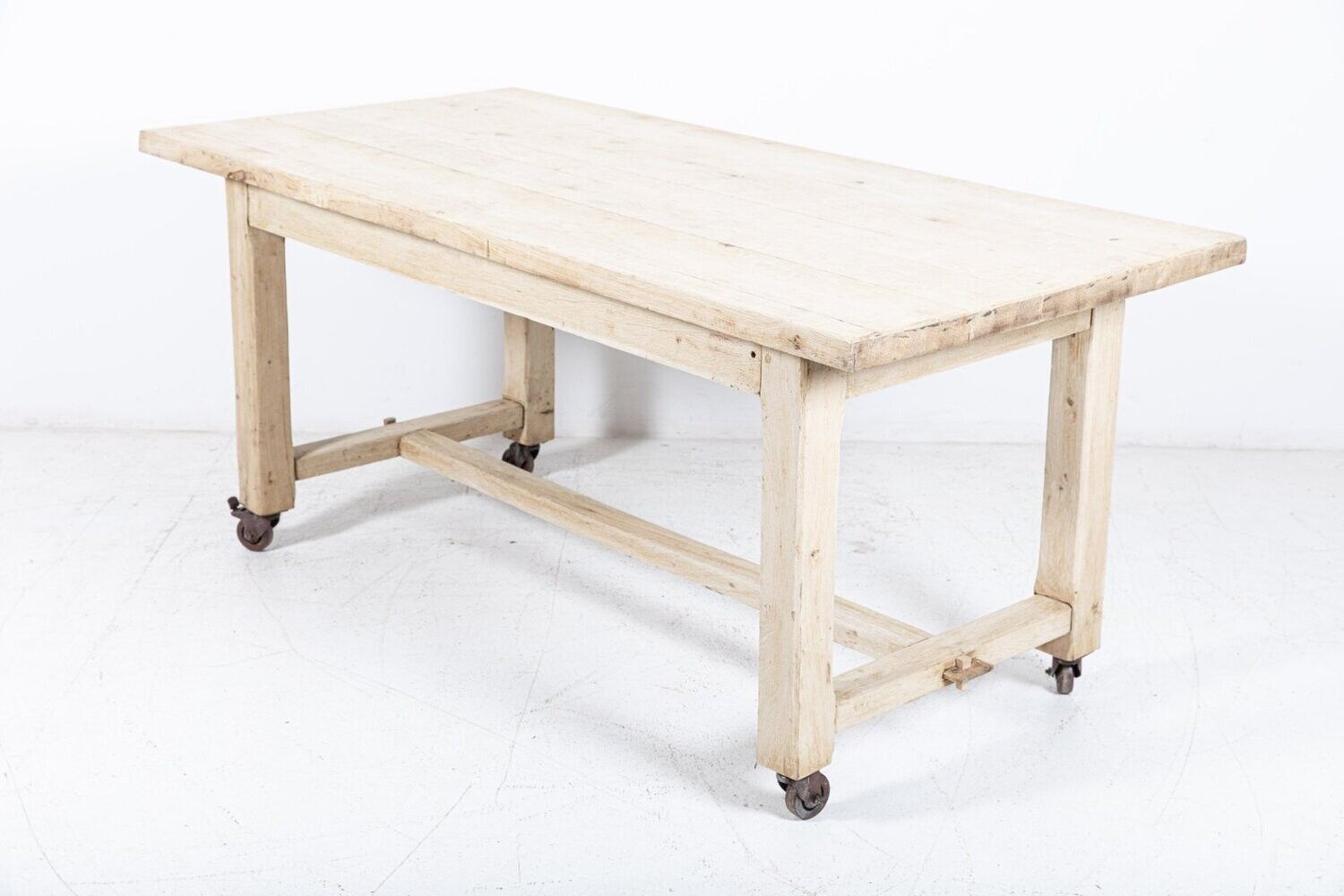 French Bleached Oak Table On Castors photo for sale