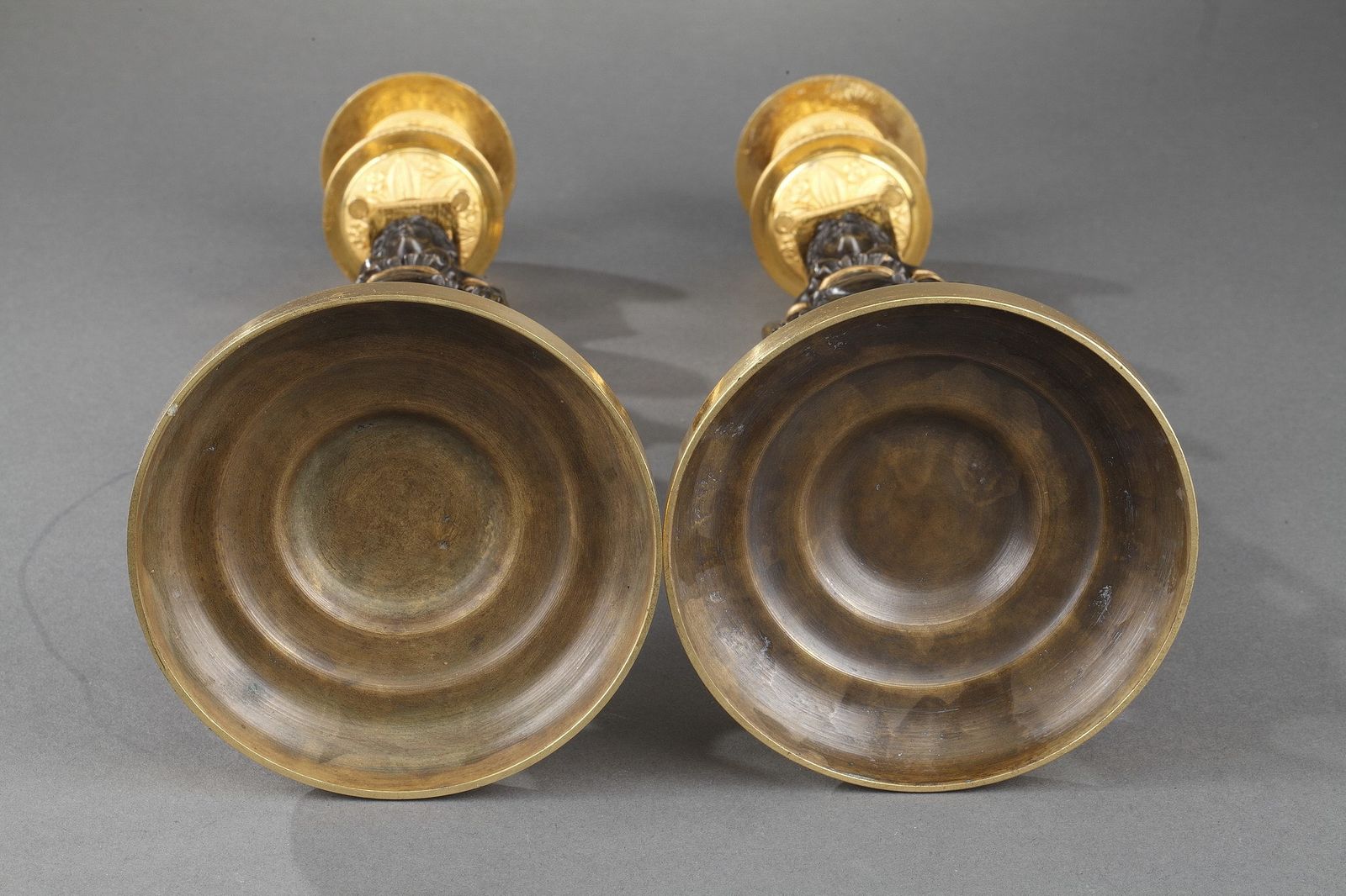 photo vintage Pair Of Charles X Candel Holders In Patinated And Gilded Bronze