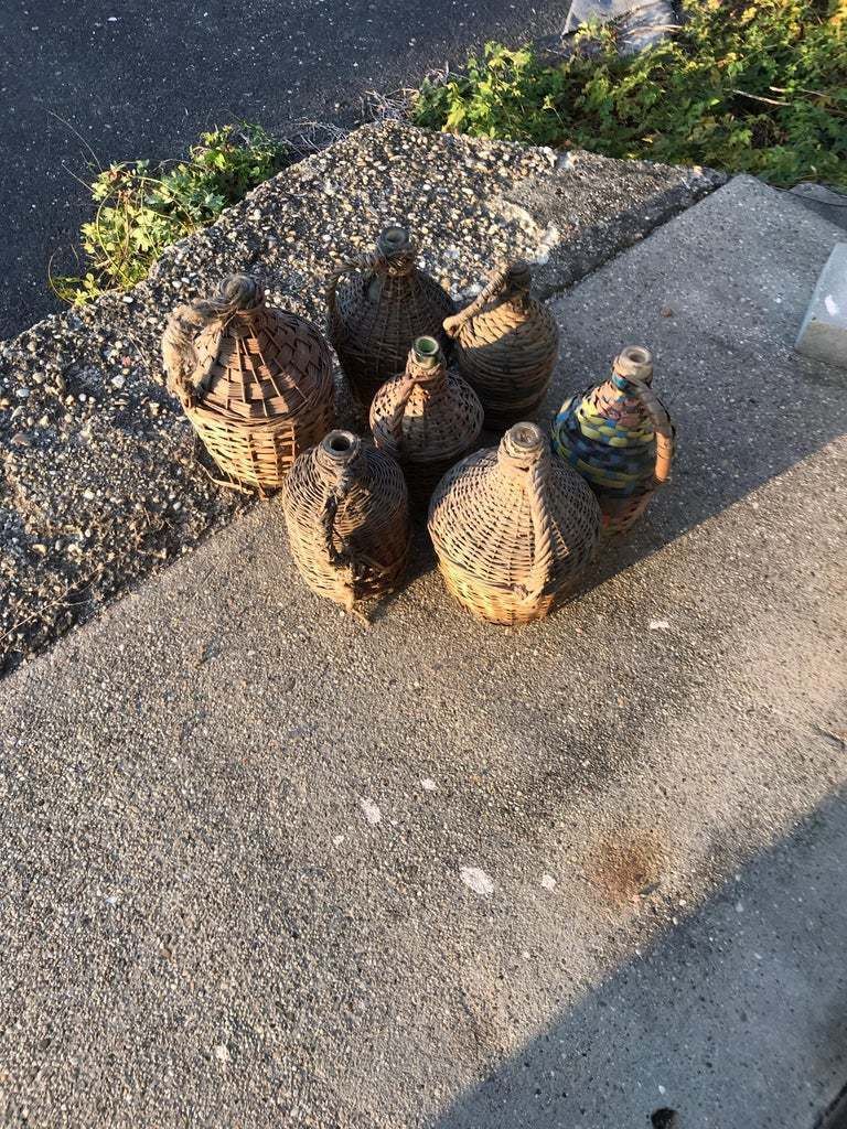 Set Of Seven Midcentury Vintner Woven Baskets With Demijohn Wine Bottles photo vinterior