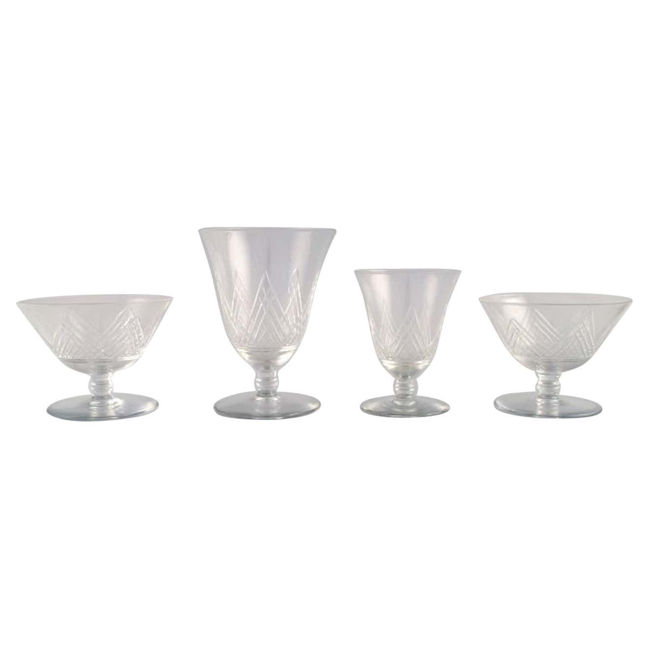 Saint Louis, France, Four Glasses In Clear Mouth Blown Crystal Glass, 1930s
