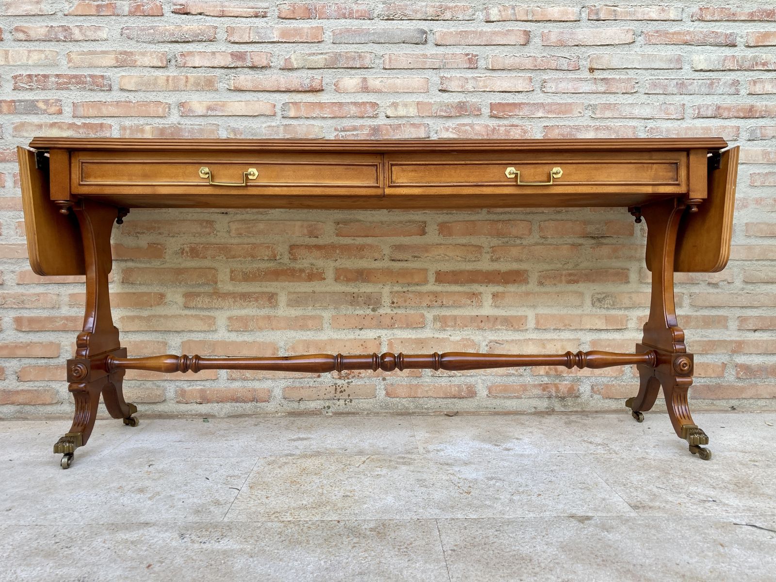 Mid 20th Century Winged Console Table In Walnut With Claw Feet In Bronze, Two Drawers And Wheels