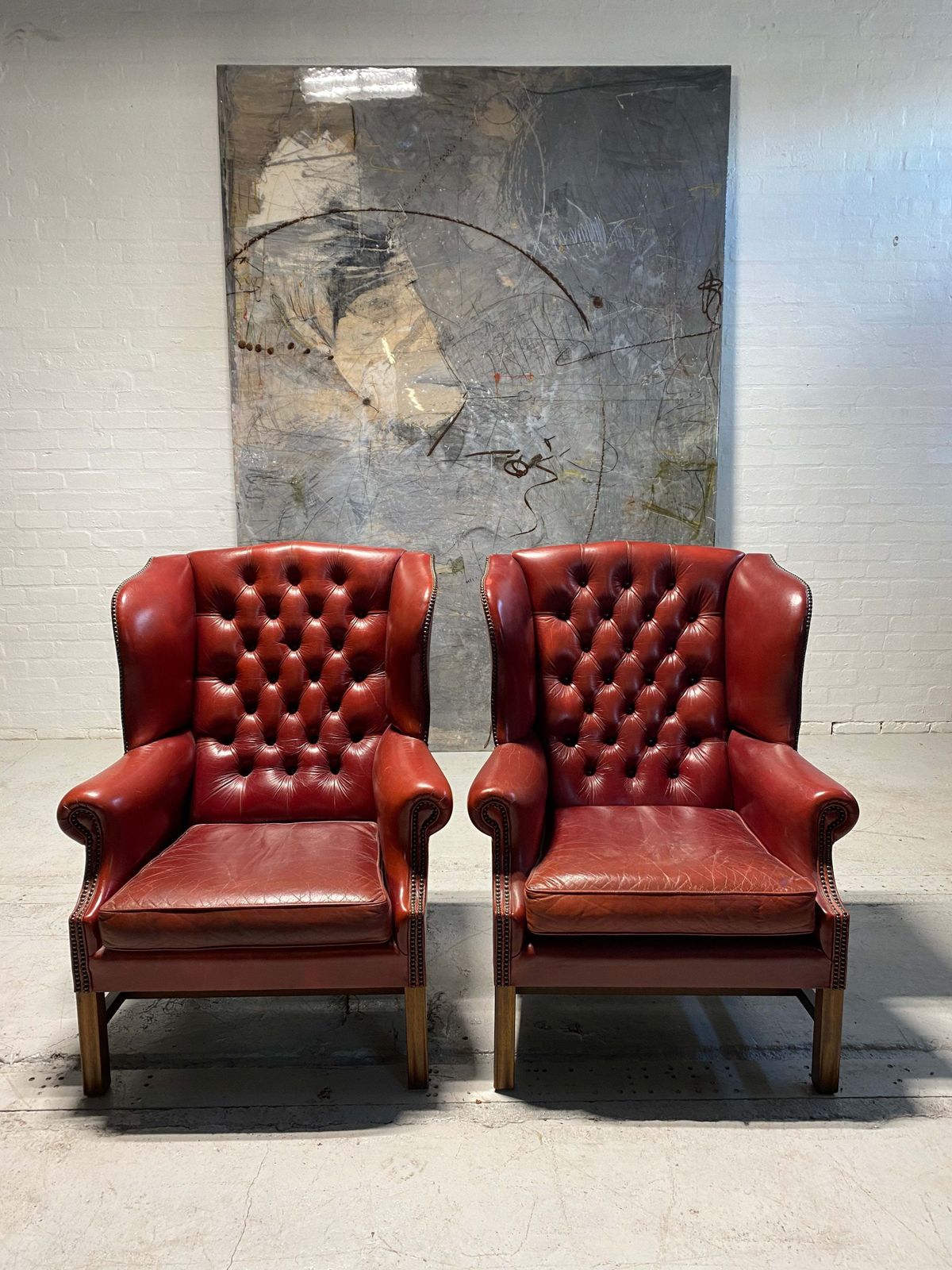 A Very Good Matching Pair Of Midc Gentleman’s Wing Chairs In Raspberry Leather photo for sale