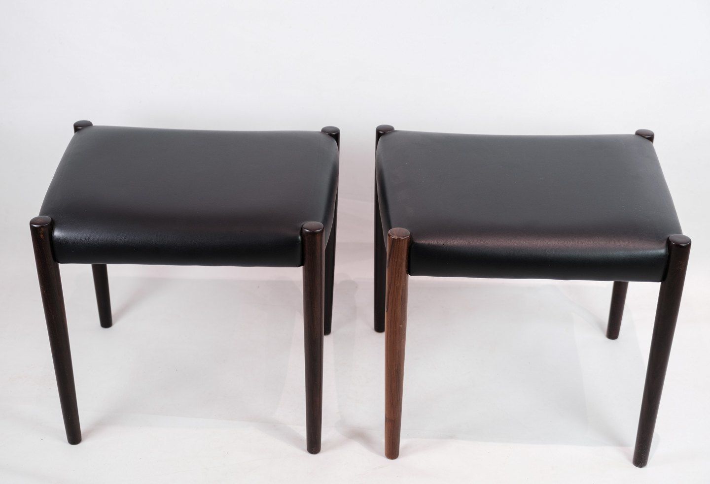 A Set Of Two Stools In Rosewood With Black Leather Of Danish Design From The 1960s. photo furniture