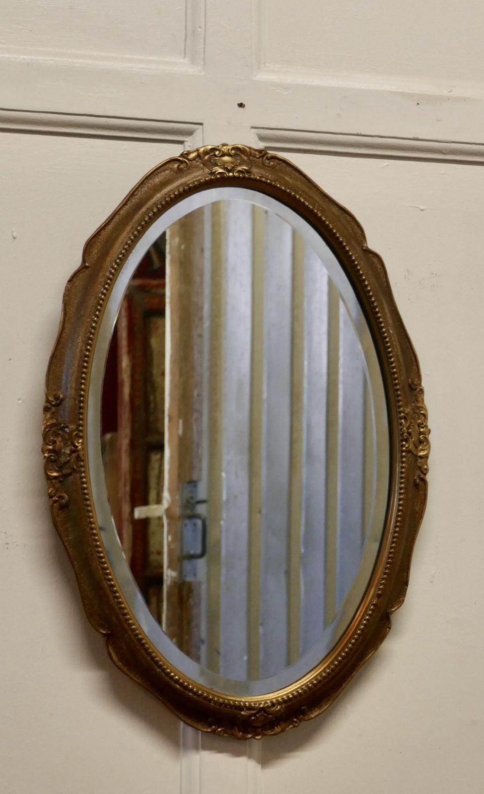 An Art Deco Oval Gilt Wall Mirror photo furniture