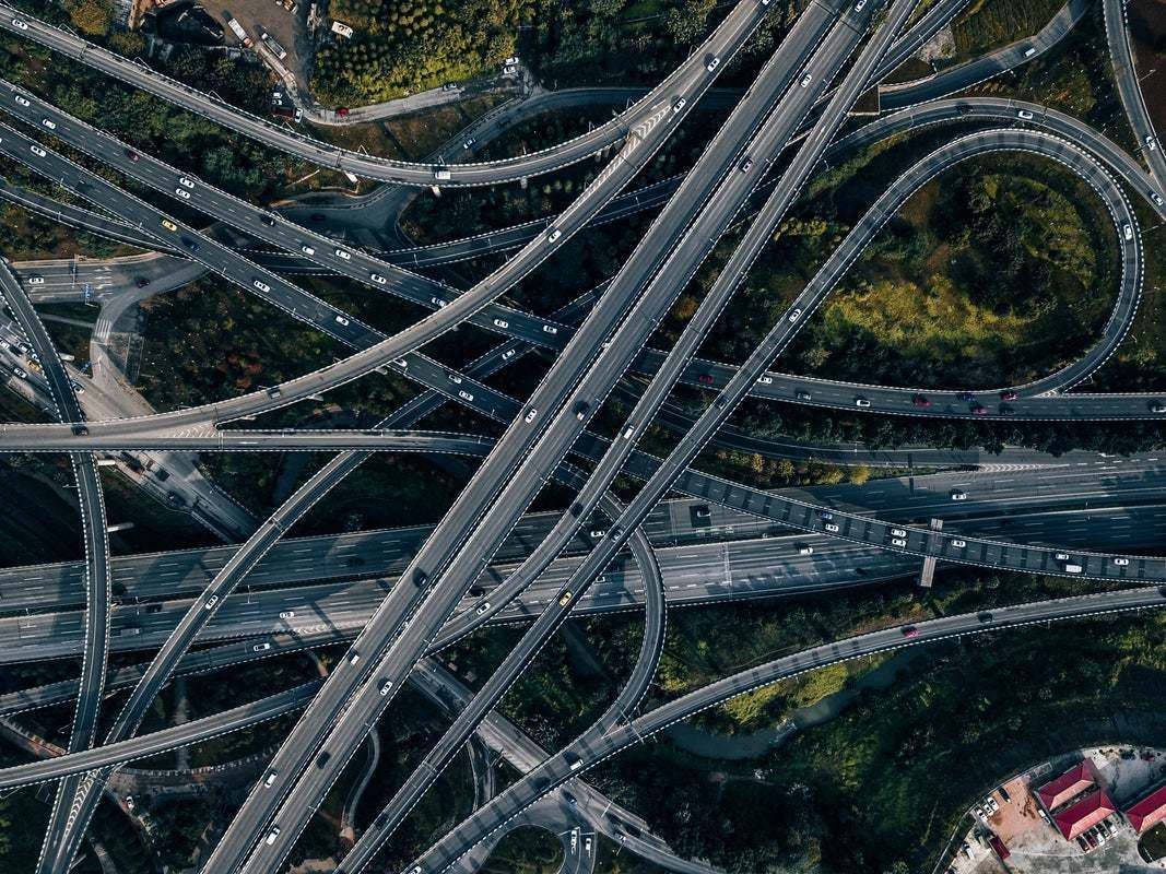 "Top View Of Road Intersection And Busy Overpass" By Aerialperspective Images