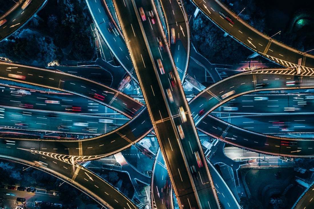 "Top View Of Overpass And Road Intersection At Night" By Aerialperspective Images"