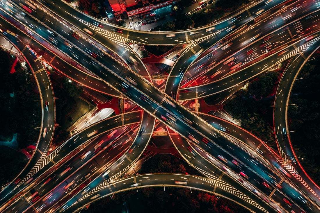 "Top View Of Overpass And Road Intersection At Night" By Aerialperspective Images"