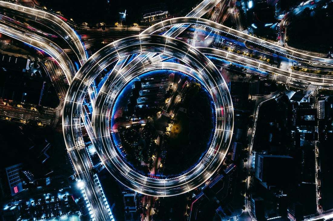 "Top View Of Overpass And Road Intersection At Night" By Aerialperspective Images