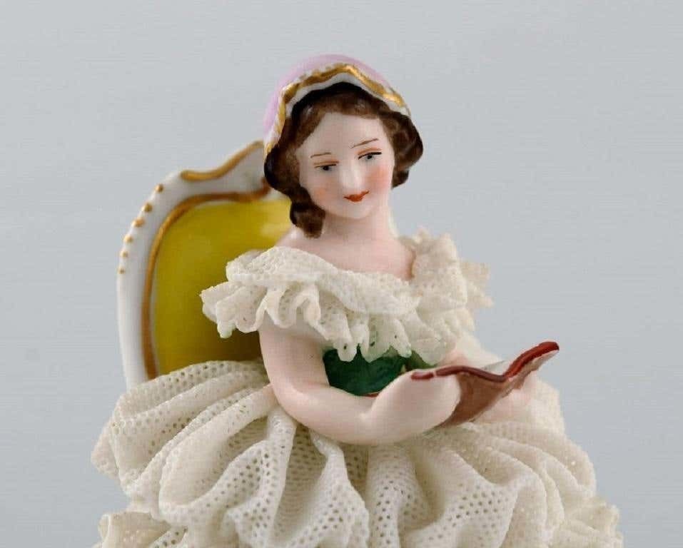 Volkstedt Rudolstadt, Germany, Porcelain Figure, Reading Woman In A Skirt photo for sale