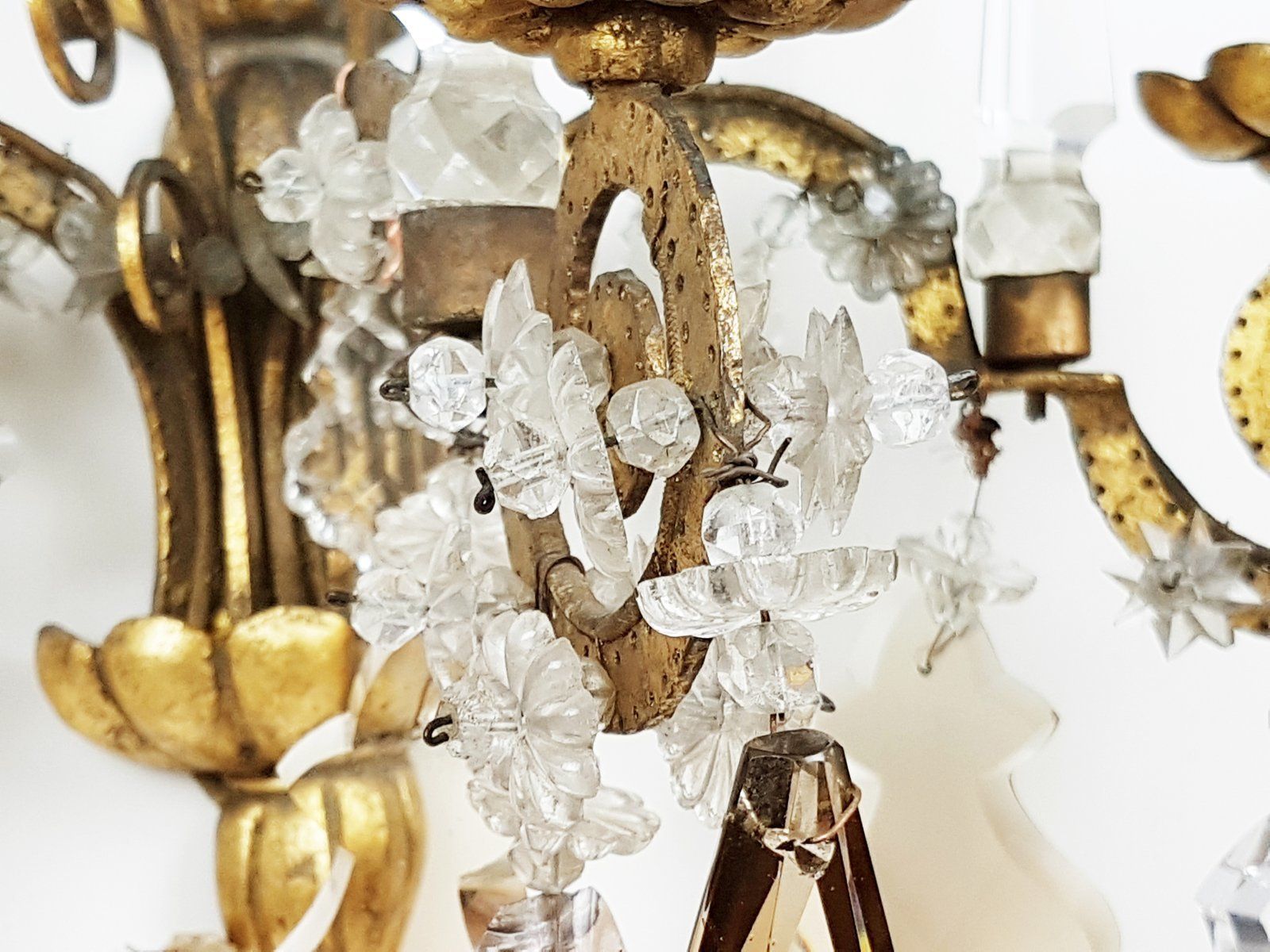 photo furniture Italian Gold Leaf Metal And Faceted Crystal Sconces With Stars And Obelisks Decor