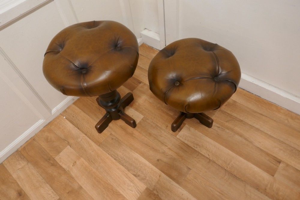 A Pair Of Sturdy French Button Leather Swivel Piano Stools photo furniture