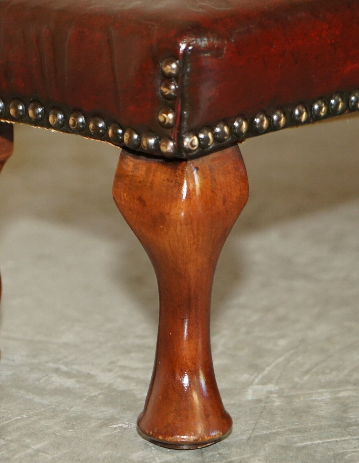 photo furniture Antique Cabriolet Leg Fully Restored Hand Dyed Bordeaux Leather Tufted Footstool