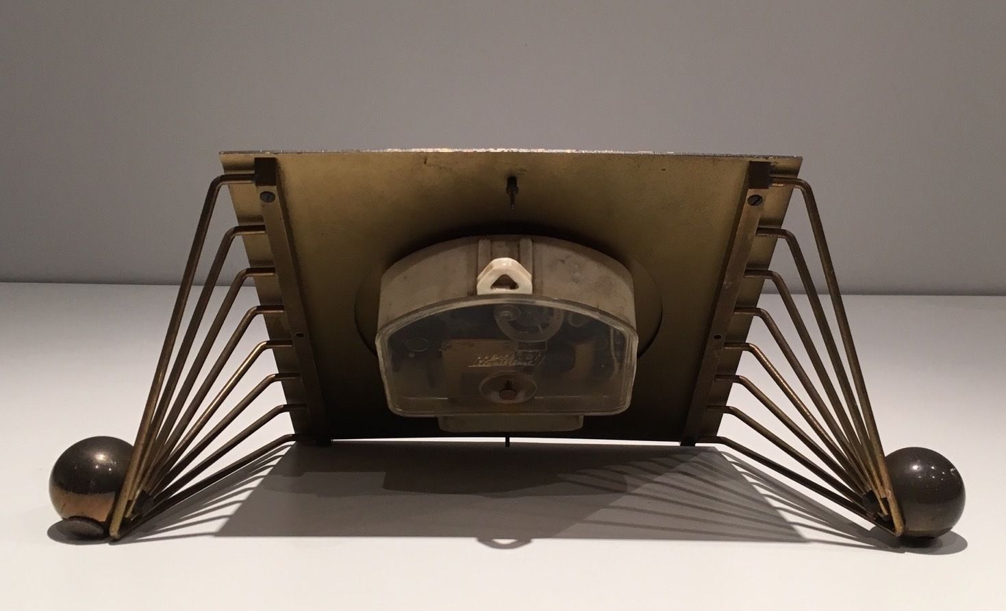photo furniture Clock In Lacquered Metal, Glass And Brass. Around 1950