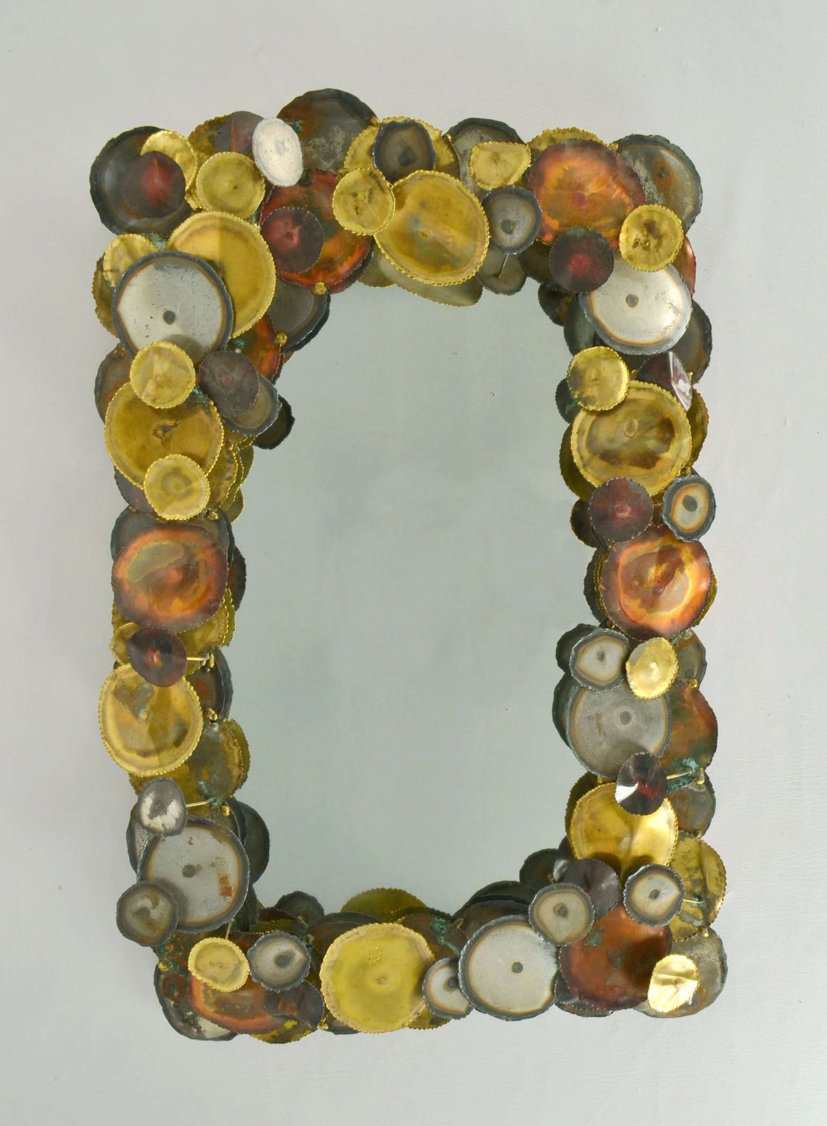 photo furniture Brutalist Wall Mirror Edged With Metal Circles In The Style Of Curtis