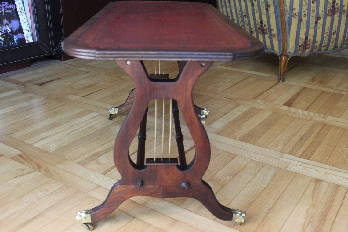photo furniture Rare Coffee Table Lyre Harp Base Sheraton Style Table On Caster Wheels And Leather Top