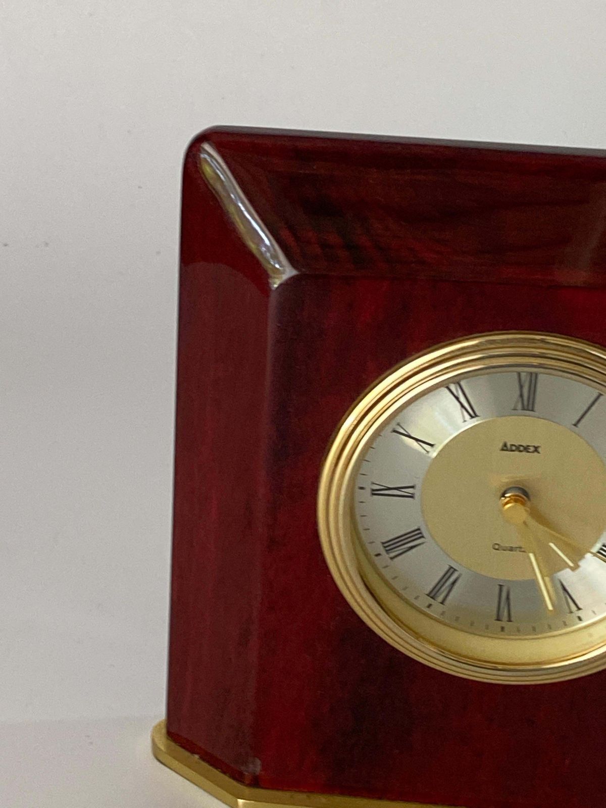 Table Clock Modern Shape Burgundy Color Hard Plastic And Brass France 1970 photo for sale