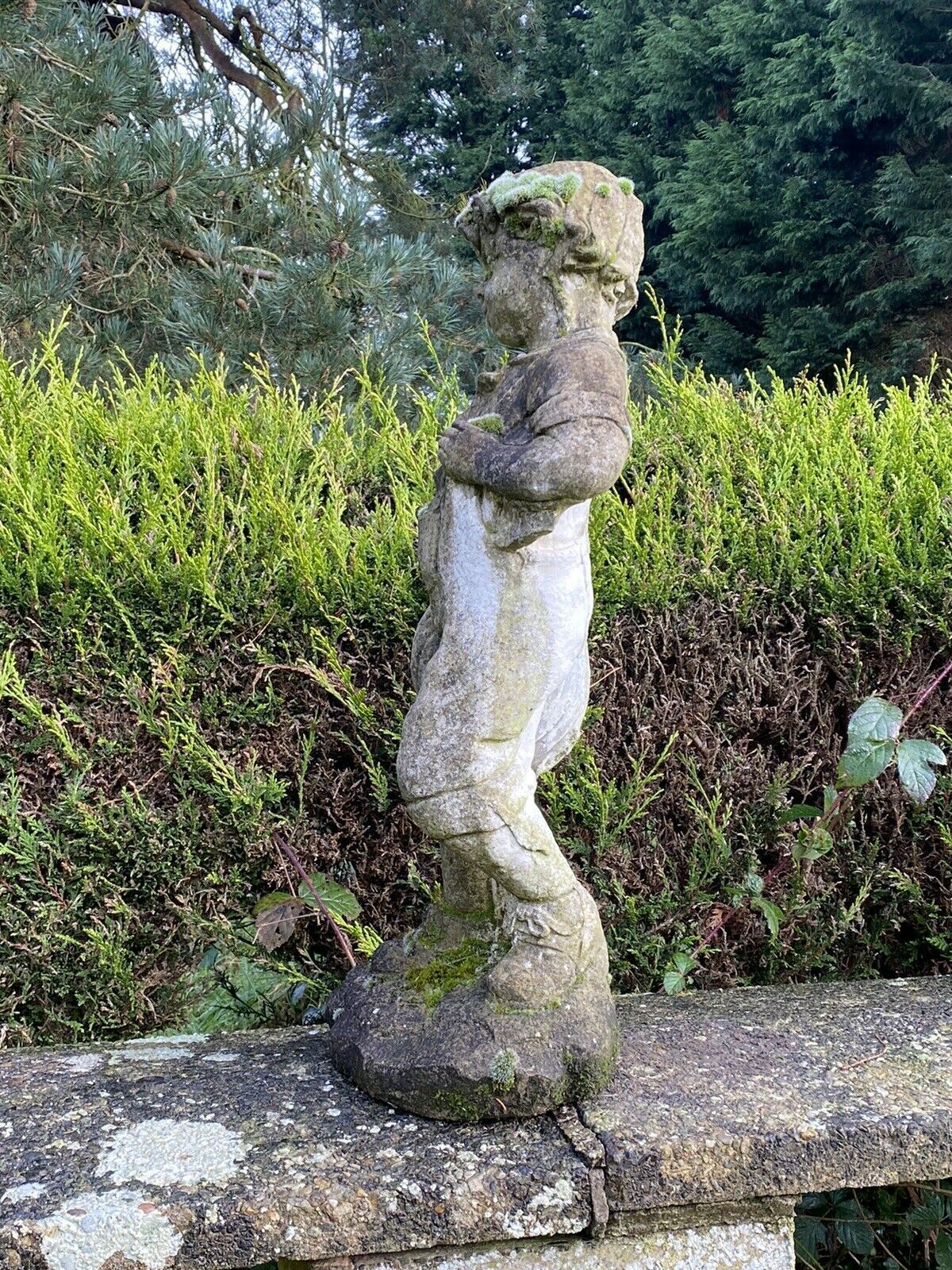 Country Estate Gardening Boy With Straw Bower Weathered Stone Garden Sculpture photo vinterior
