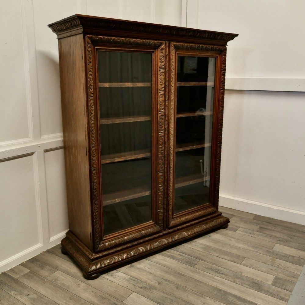 Fine Quality 19th Century Carved Oak Glazed Bookcase. photo for sale