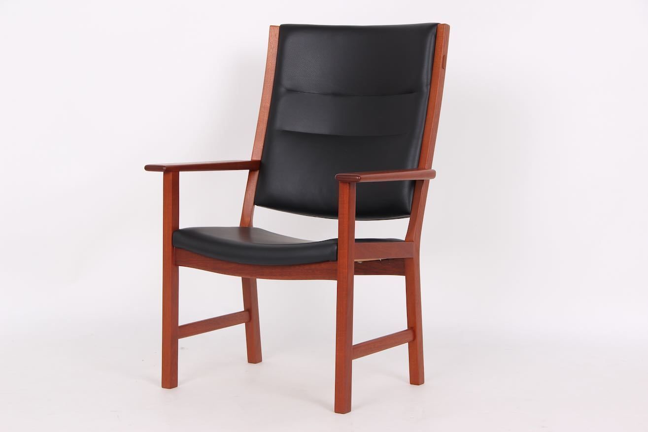 Hans J. Wegner Armchair. Renovated And Upholstered With Black Leather. Johannes Hansen Cabinetmaker.