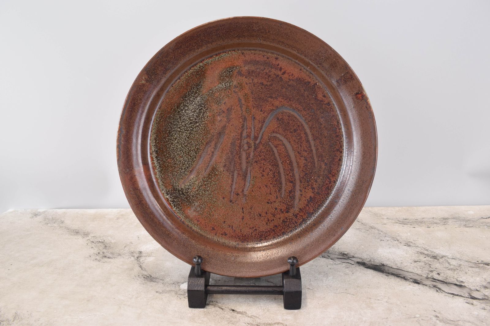 Studio Pottery; Iron Glaze Charger With Finger Wipe Decoration.